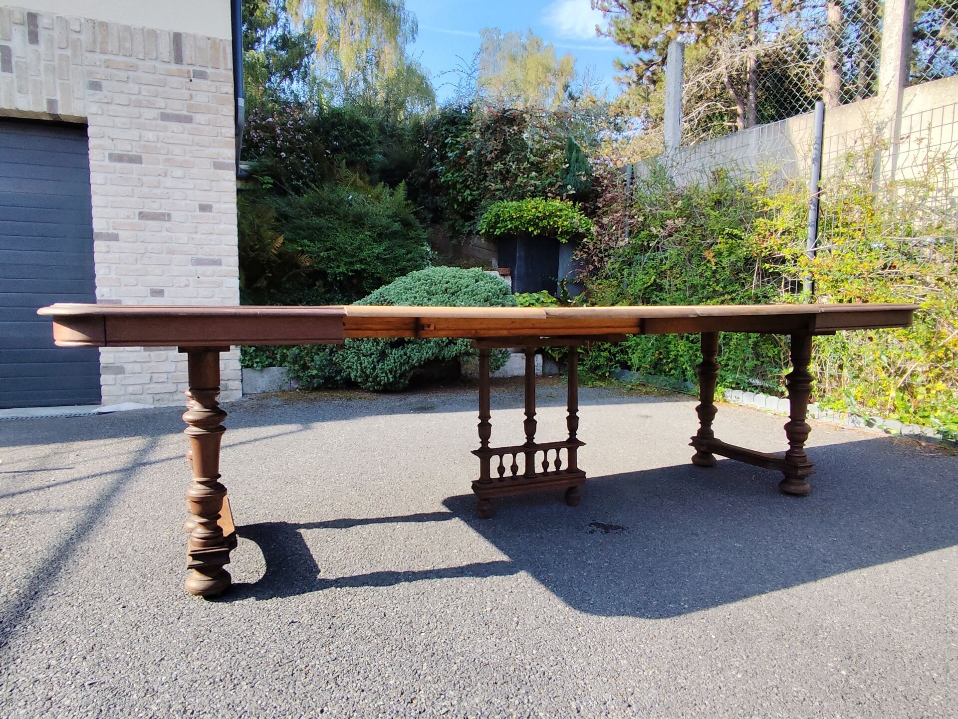 Square wooden table in Henri II style.