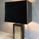Large lamp in black lacquered wood, gilding and mother-of-pearl. French work. Circa 1970