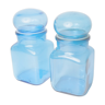 Pair of blue pharmacy bottles Ariel