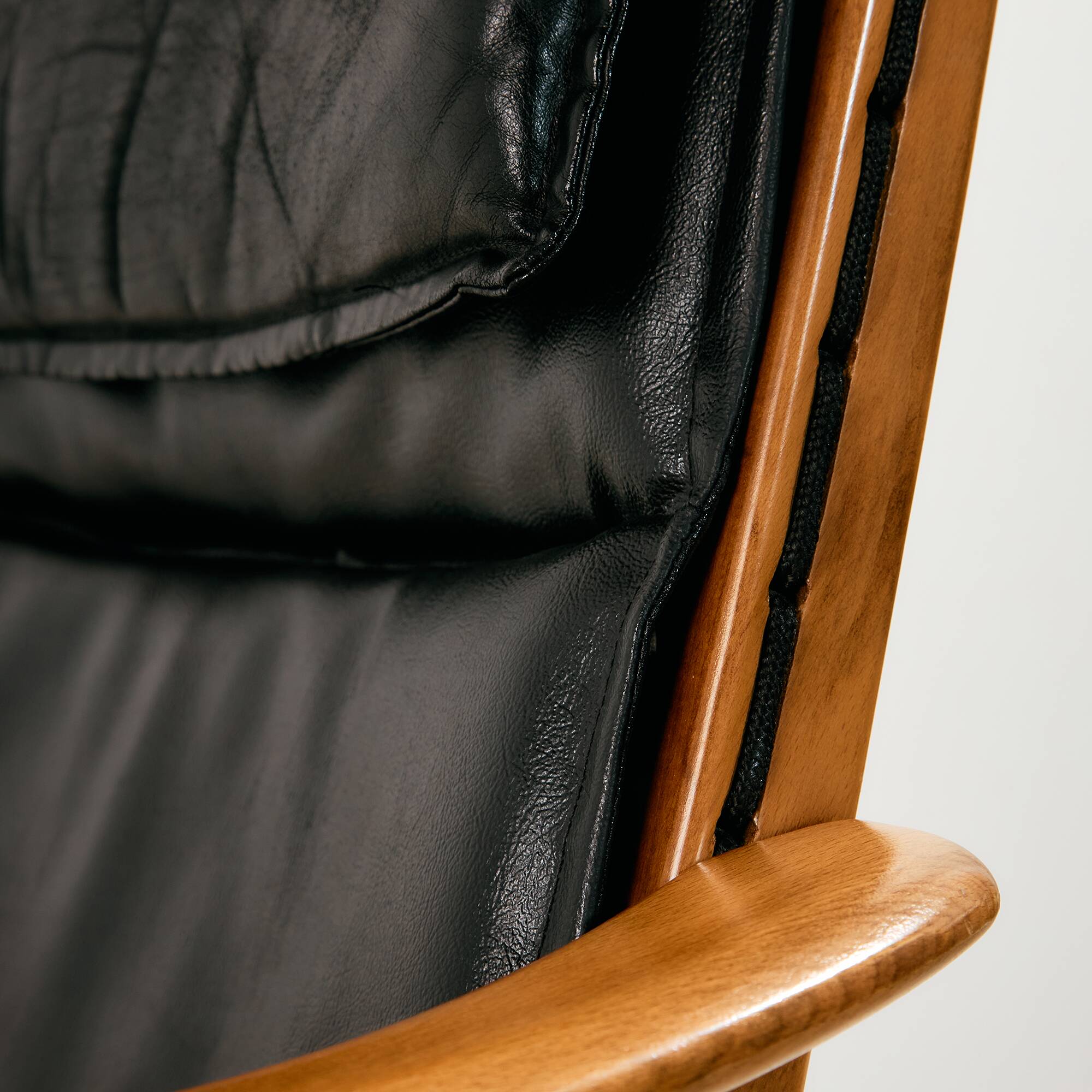 Beech armchair with leather upholstery