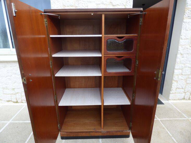 Wardrobe on a plinth in walnut and walnut veneer circa 1940.