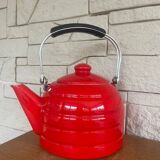Old red enameled kettle