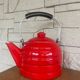 Old red enameled kettle
