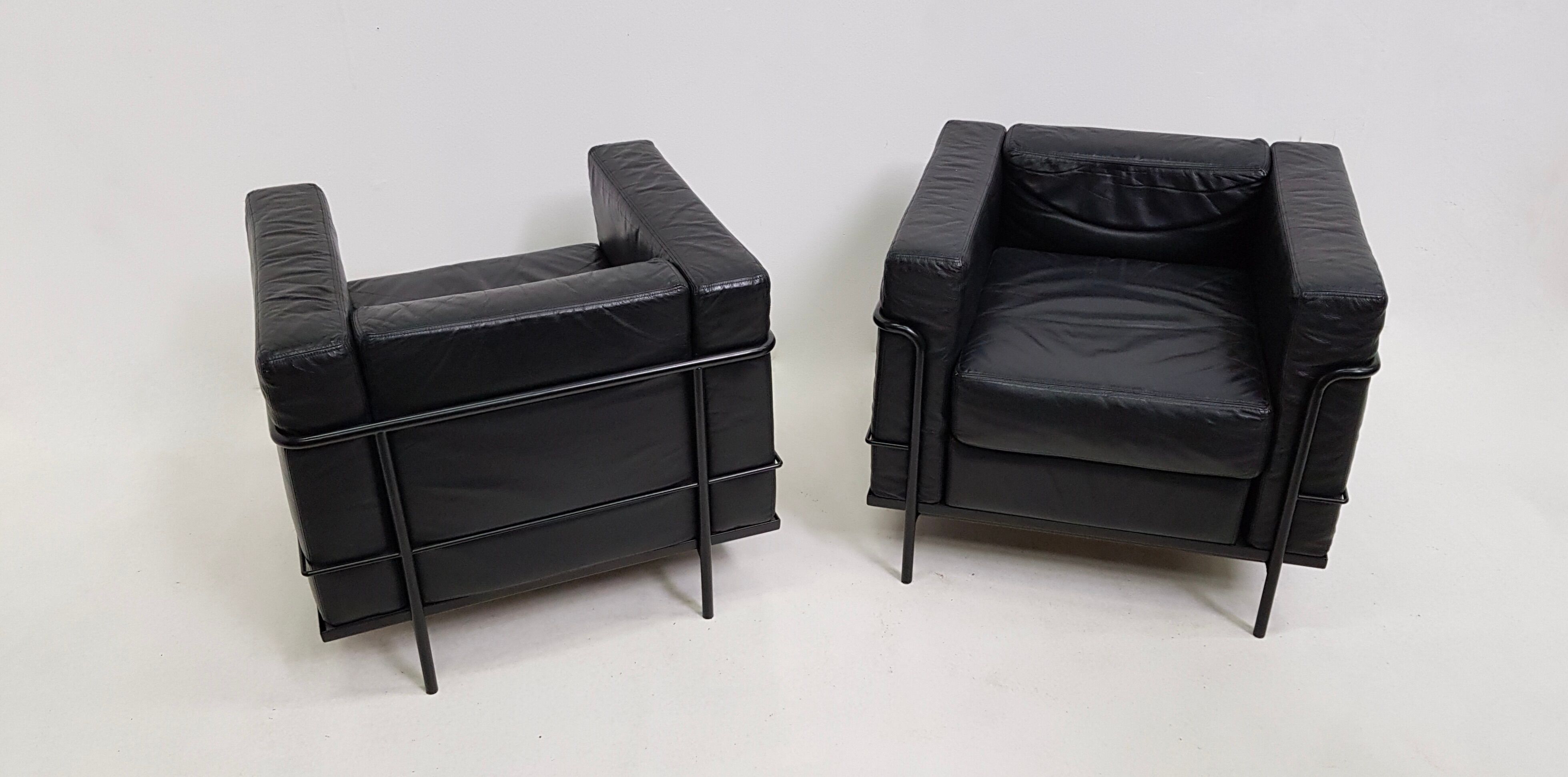 Pair of vintage armchairs Hugues Chevalier in leather 1980
