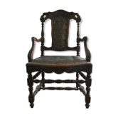 Old carved wooden armchair