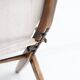 Pair of varnished wooden reclining armchairs, upholstered in lightweight fabric.
