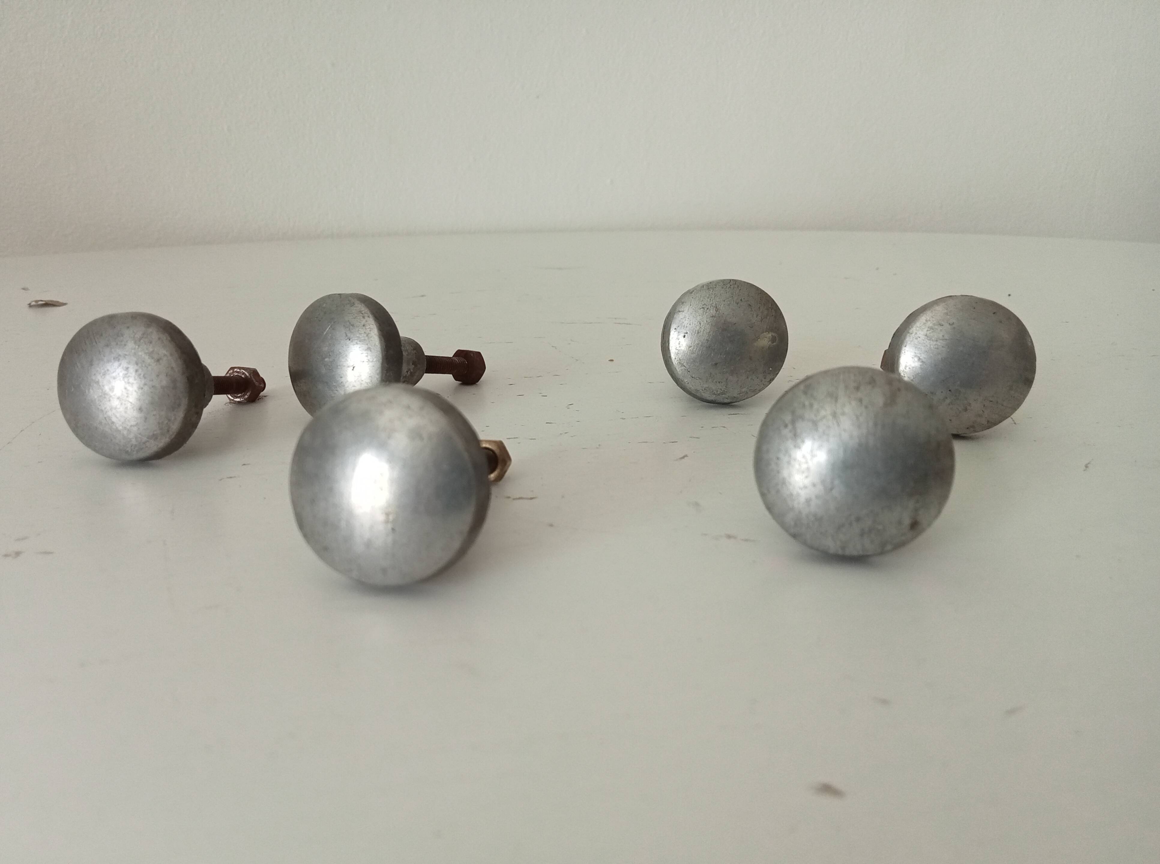 Pair of antique solid aluminium furniture handles.