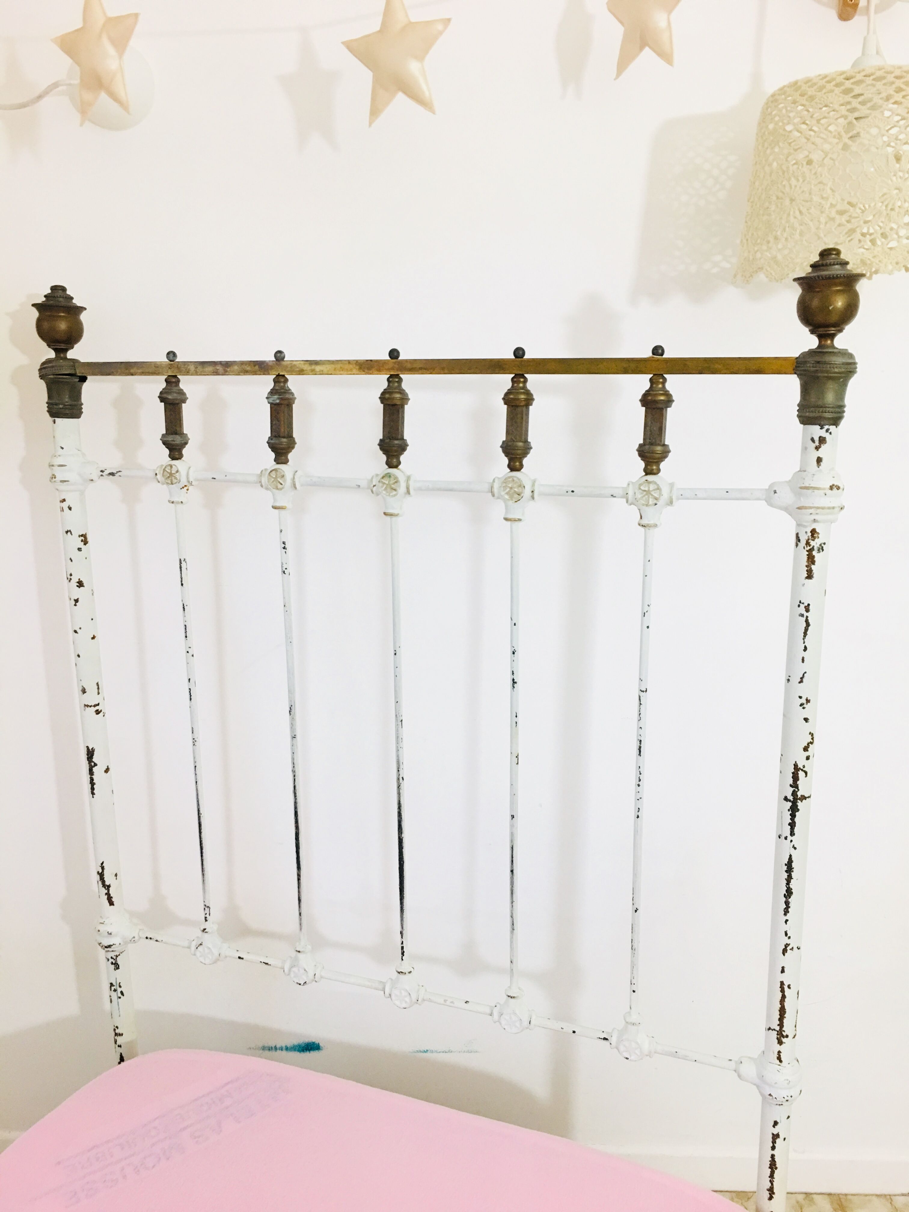 Old white metal and brass bed