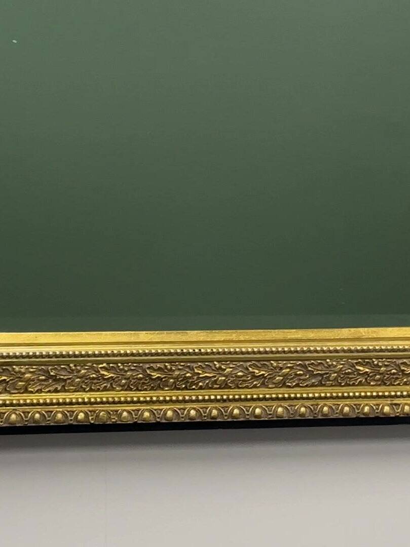 Vintage rectangular classical gold and black mirror. France, 1970s.
