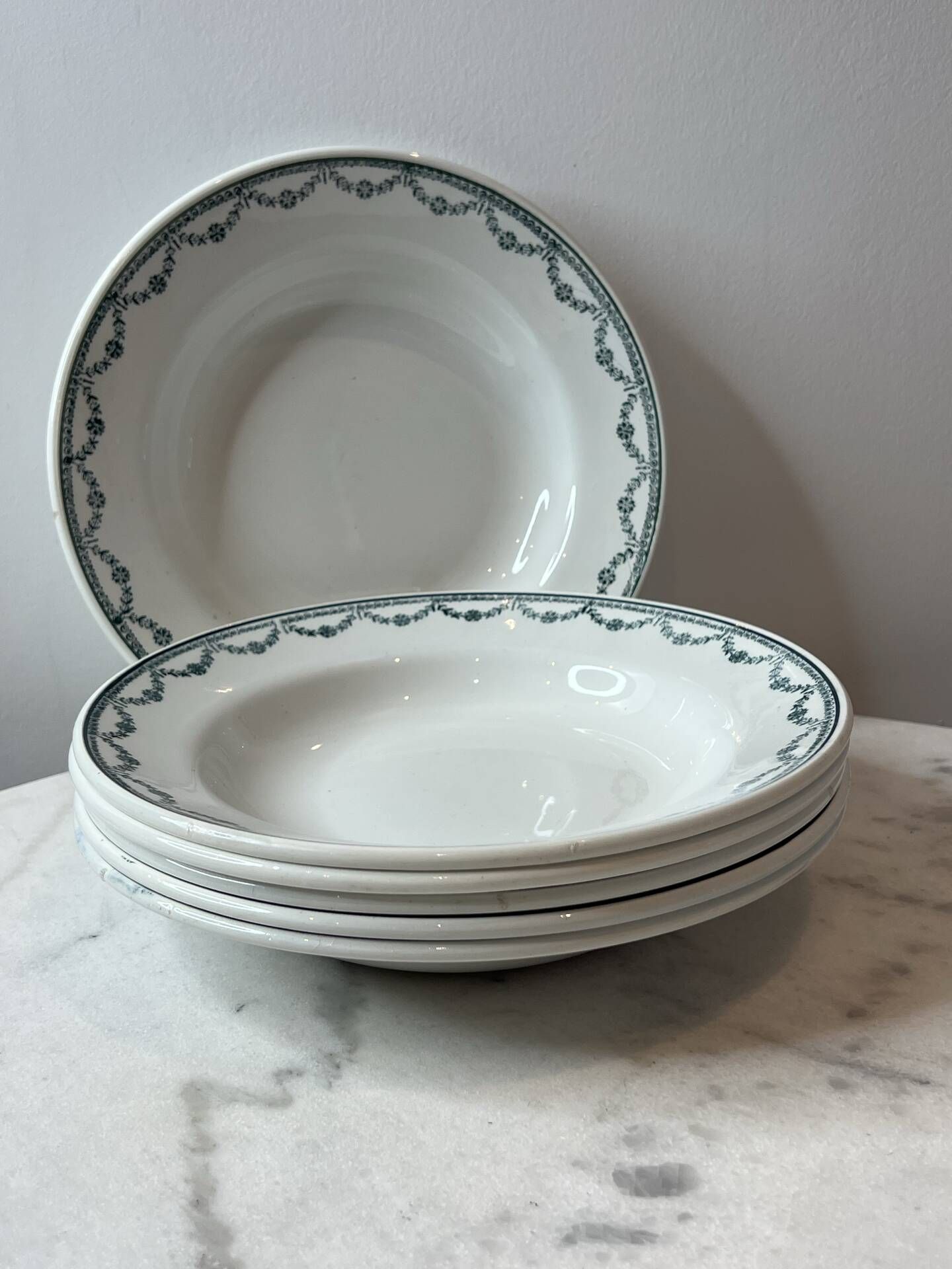 Set of 6 deep plates Saint Amand with floral garland decoration.