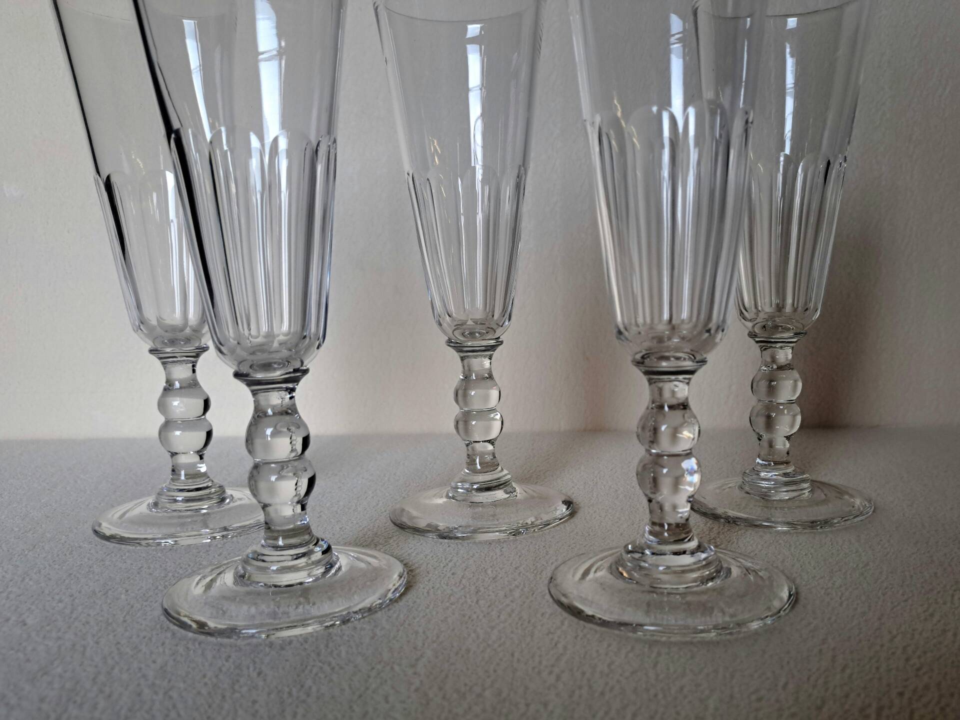 5 crystal Champagne flutes from Baccarat, Clermont model, 19th century.