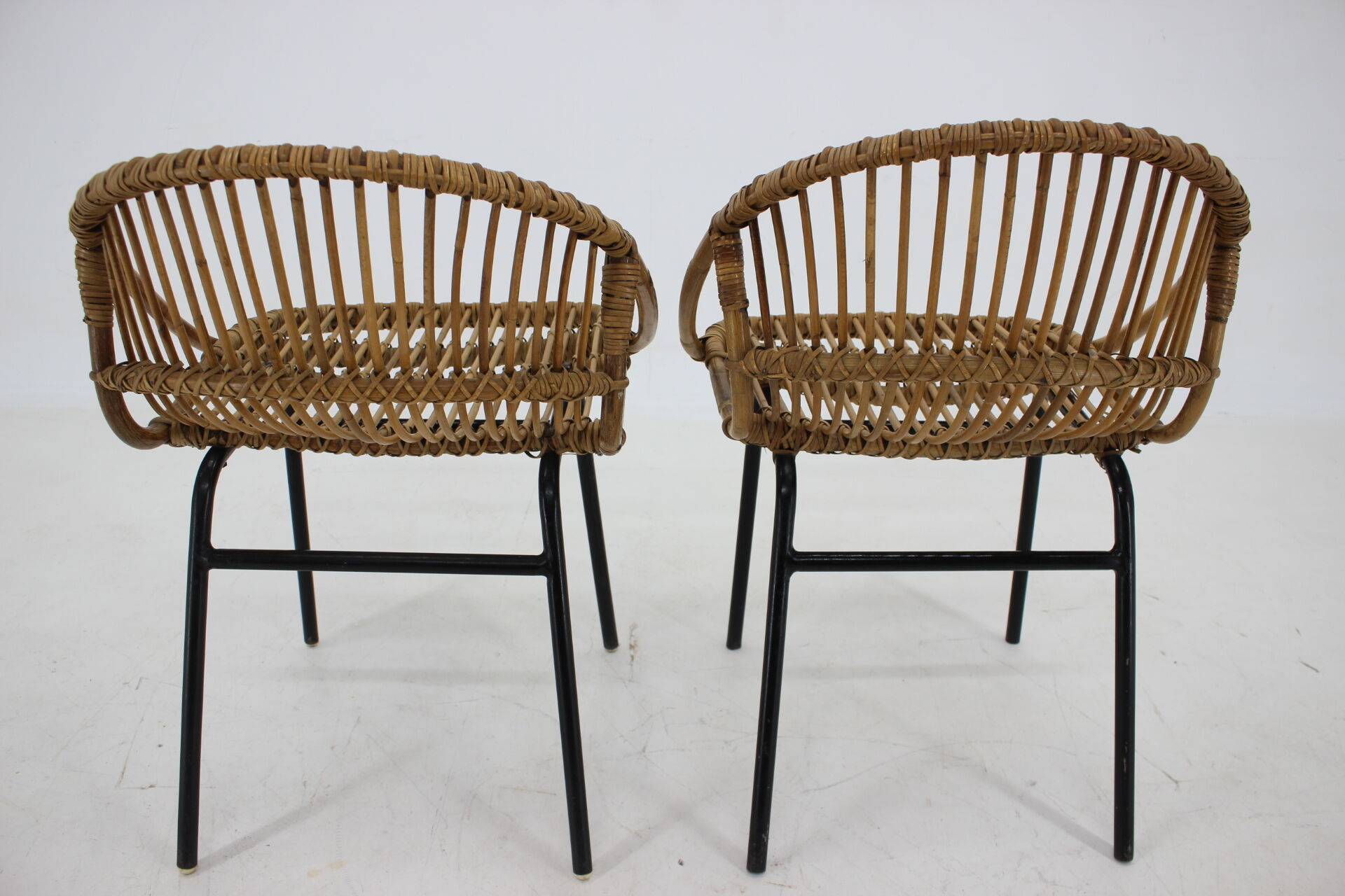 1970s pair of Alan Fuchs rattan and iron lounge chairs, Czechoslovakia