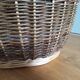 Very large oval laundry basket in two-tone braided wicker with handles