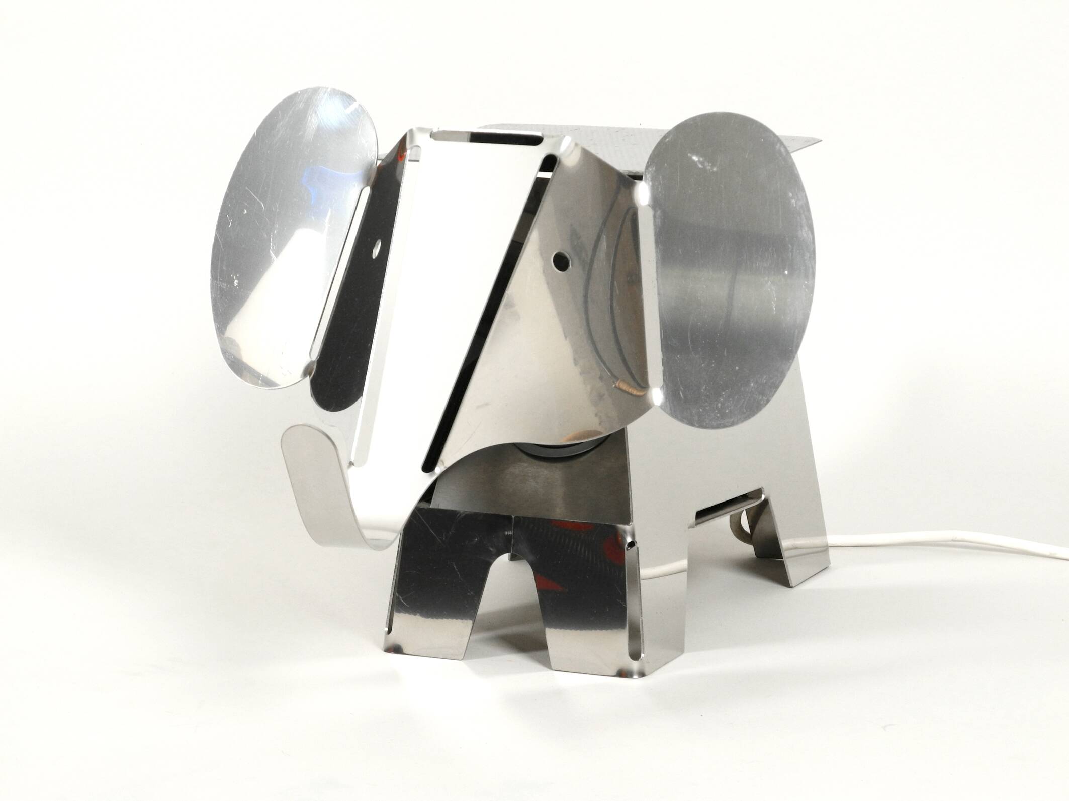 80s heavy metal chrome elephant floor lamp as side table Postmodern design