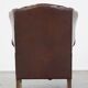 Comfortable, elegant, stately wing chair made of sheepskin in a beautiful warm color