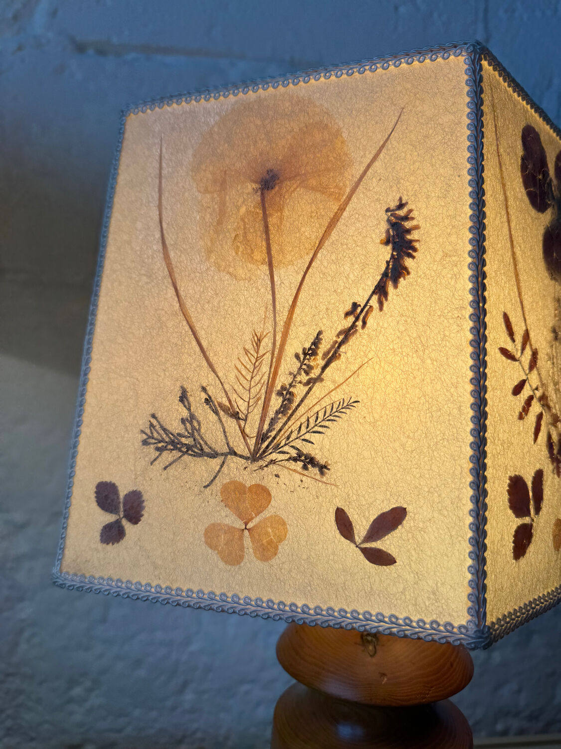 Turned wood lamp with a herbarium lampshade from the 1970s.