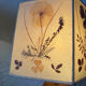 Turned wood lamp with a herbarium lampshade from the 1970s.
