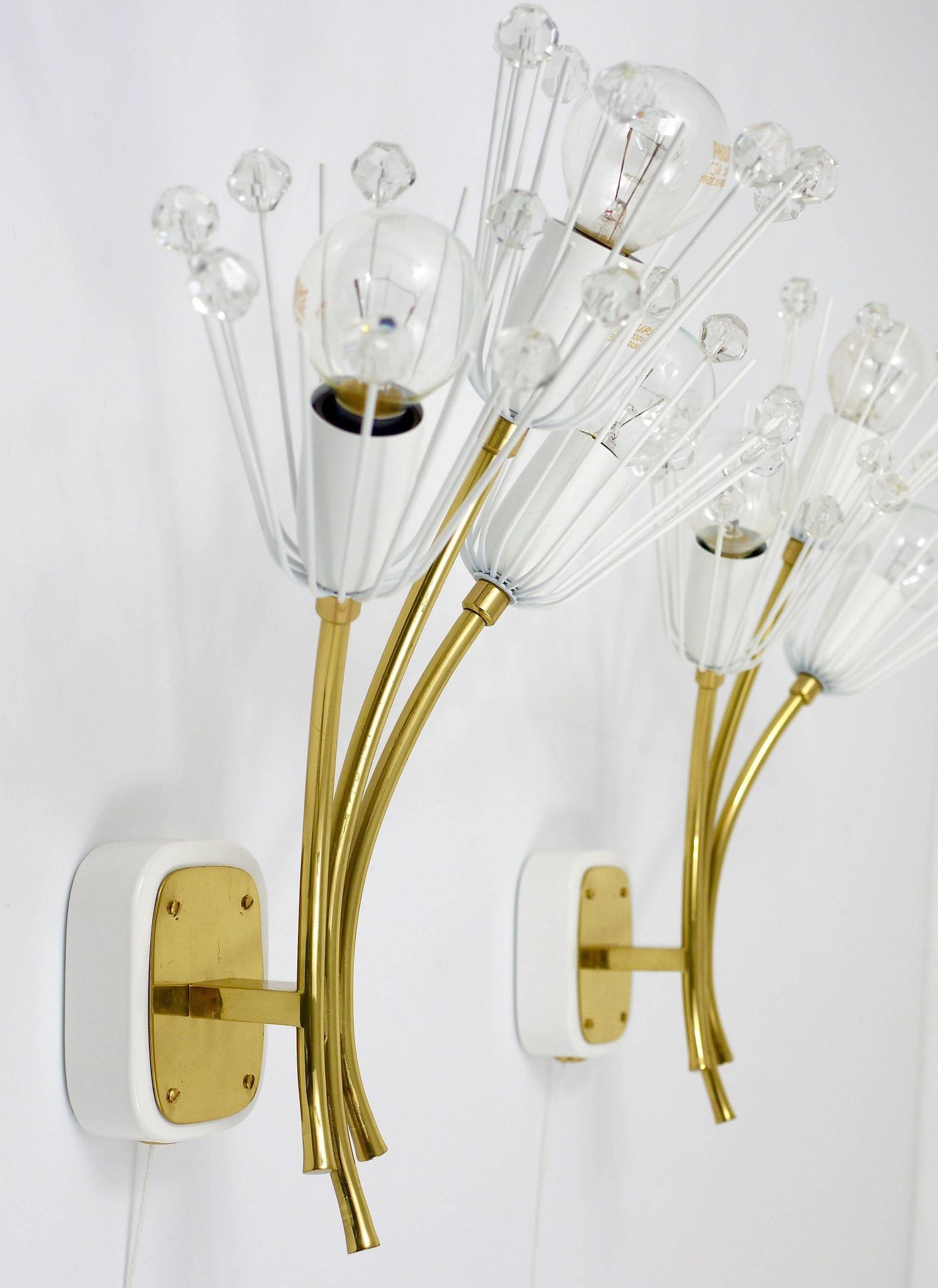 Pair of mid-century wall sconces in brass with flowers, Emil Stejnar, Rupert Nikoll, Austria, 1950s.