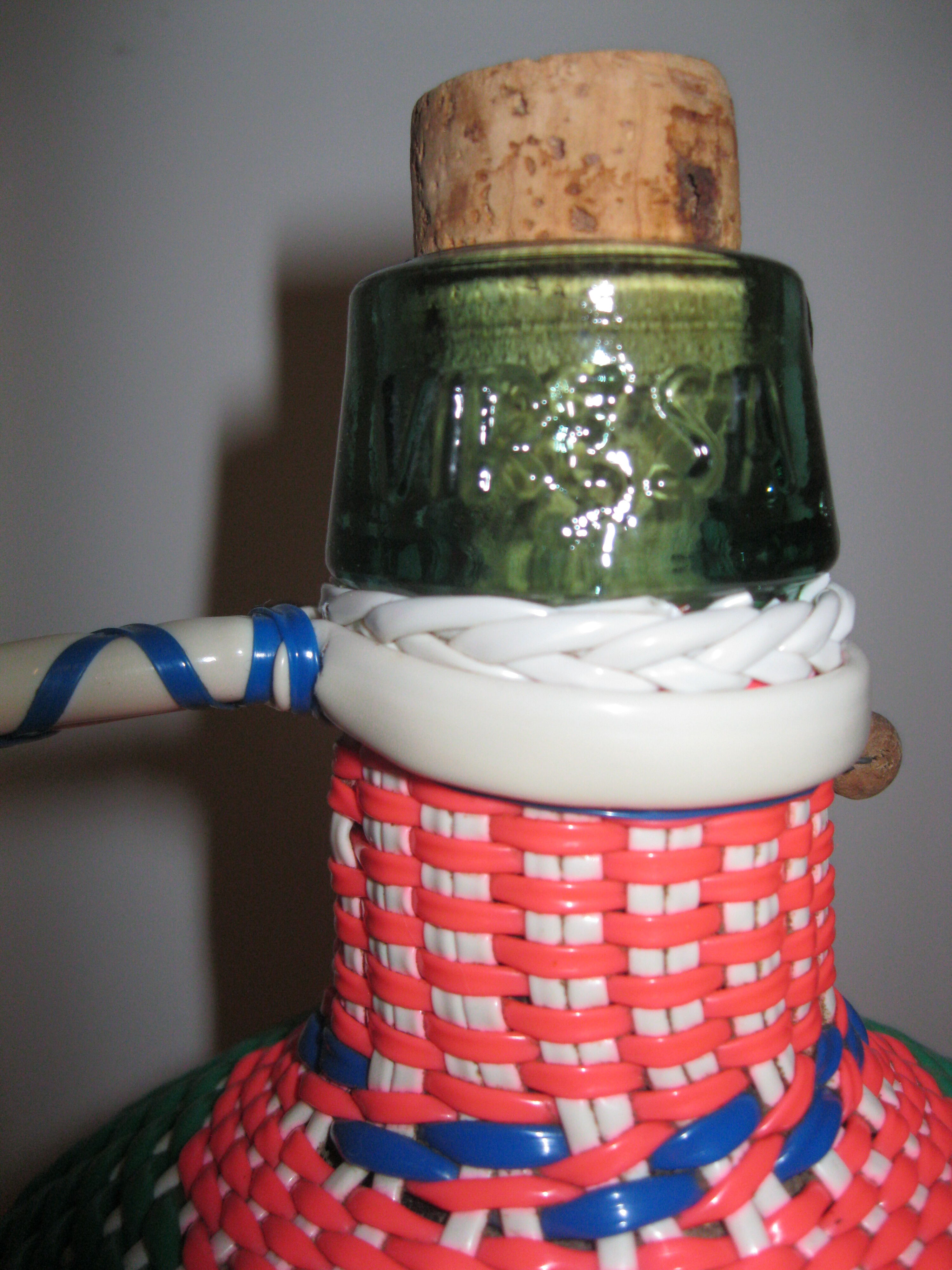 Vintage and multi-coloured demijohn