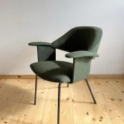 Curved vintage wool armchair from the 1960s