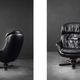 Vintage black leather swivel chair in mid-century modern Scandinavian style.