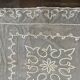 Old tablecloth embroidered with openwork embroidery.