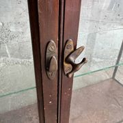 Dark-stained wood and glass vintage display cabinet — early 20th-century wall-mounted showcase