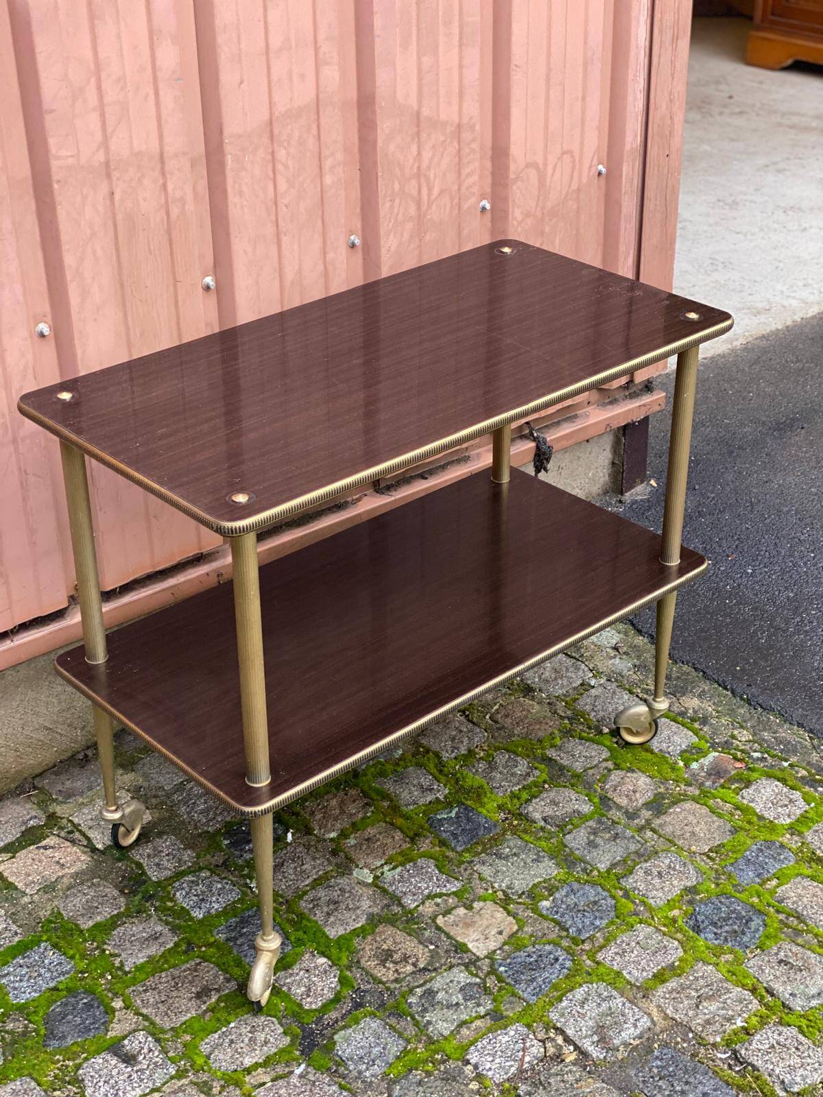 Brown rosewood rolling table with gold fluted legs
