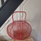 very large vintage red metal basket with handle
