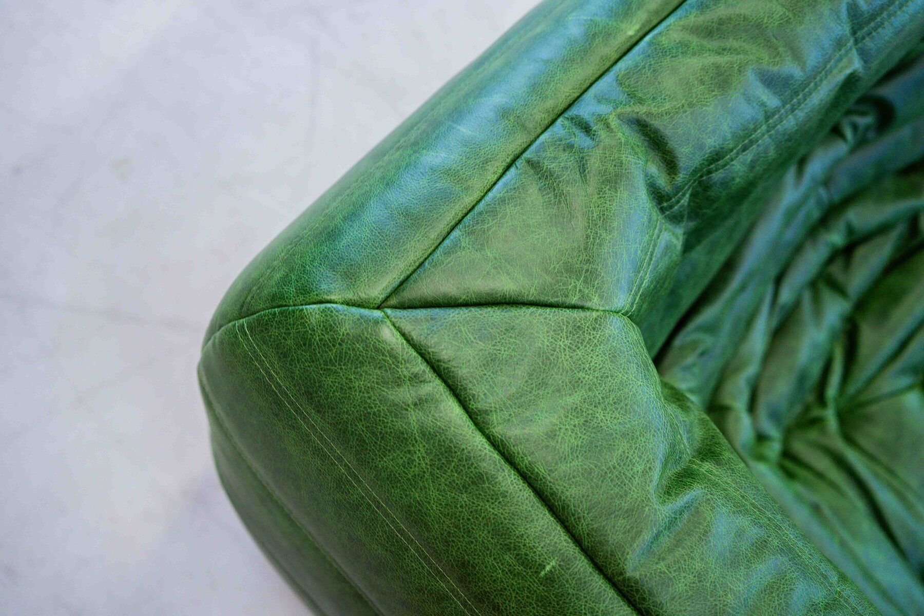 Vintage two-seat Togo sofa with arms in green leather by Michel Ducaroy for Ligne Roset, 1970s