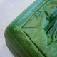 Vintage two-seat Togo sofa with arms in green leather by Michel Ducaroy for Ligne Roset, 1970s