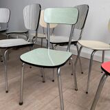 10 mismatched multicolored Formica chairs 60s