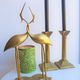 Paire de bougeoirs colonnes en laiton et bronze
