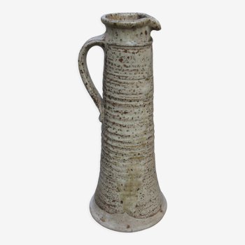 Sandstone pitcher swaddled by André Gutman