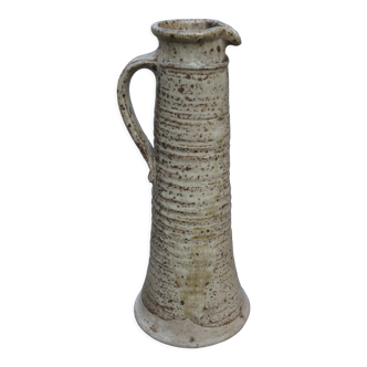 Sandstone pitcher swaddled by André Gutman