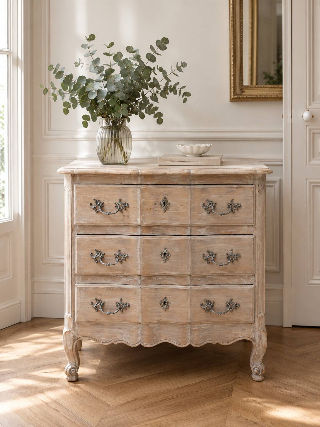 Beautifully crafted Louis XVI style commode in bleached wood.