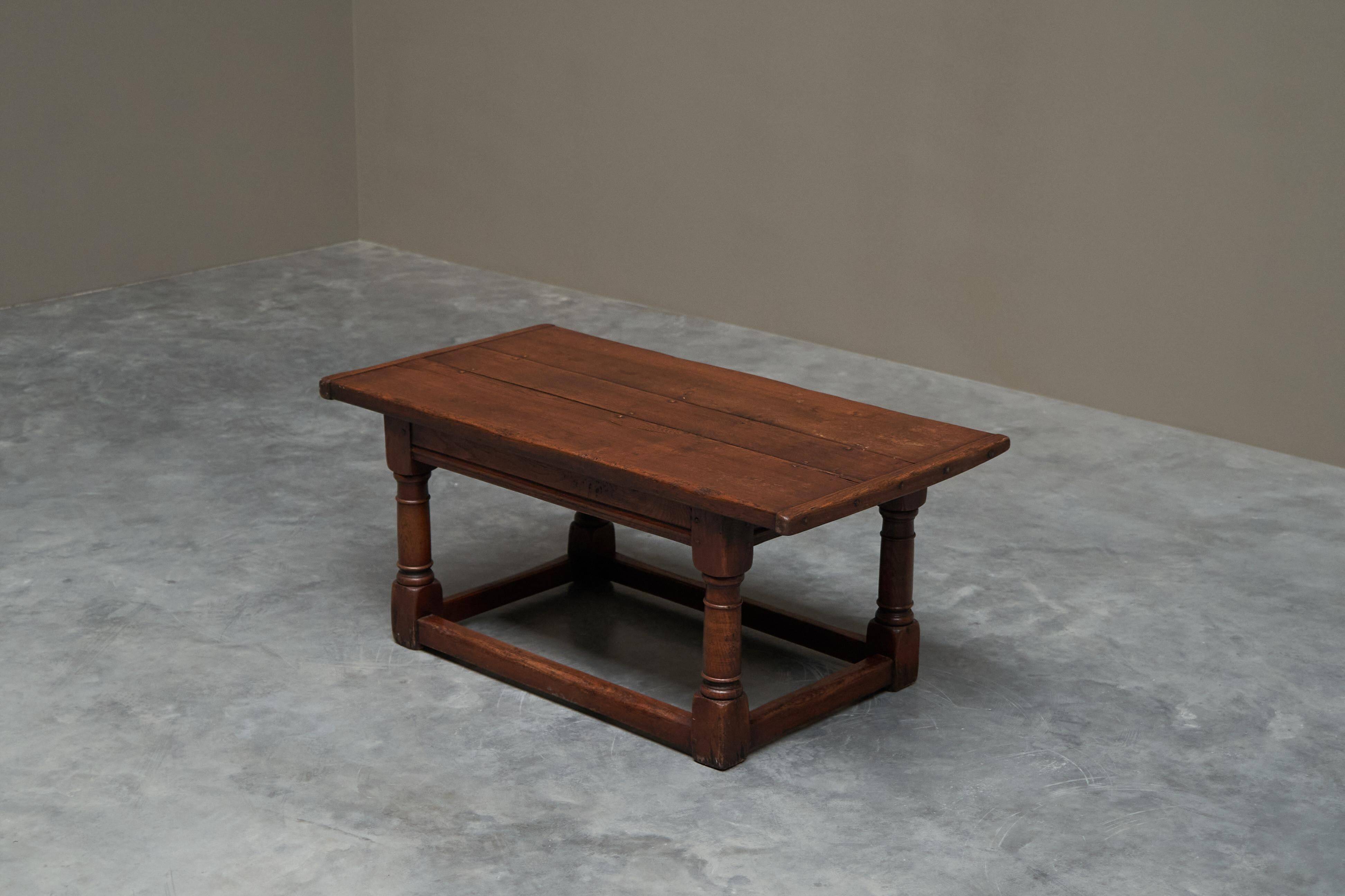 Antique solid oak coffee table in refectory style, 19th century.