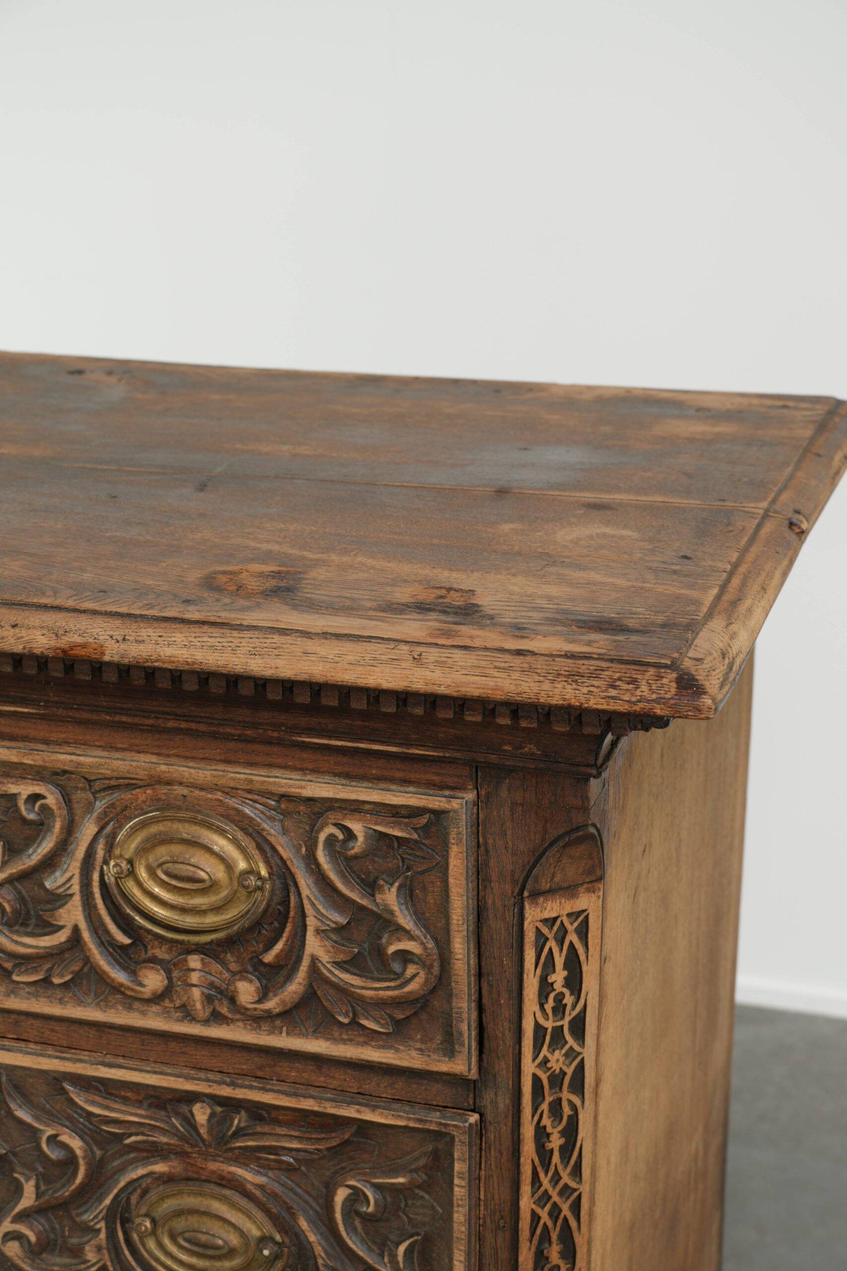 Richly carved English oak chest of drawers from the 18th century