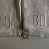 Pair of modernist linen pillowcases embroidered with comic strips