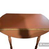 Round wooden table with folding sides