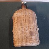 Set of two glass and wicker bottles