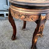 Old wooden saddle pedestal table with claw feet