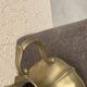 Vintage brass pitcher with "petal" patterns — decorative S-shaped handle, 1950s.
