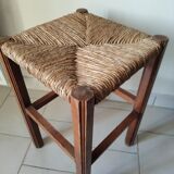 Antique campaign stool in solid wood with a straw seat.