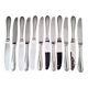 Set of 12 monobloc table knives in Comargent steel.