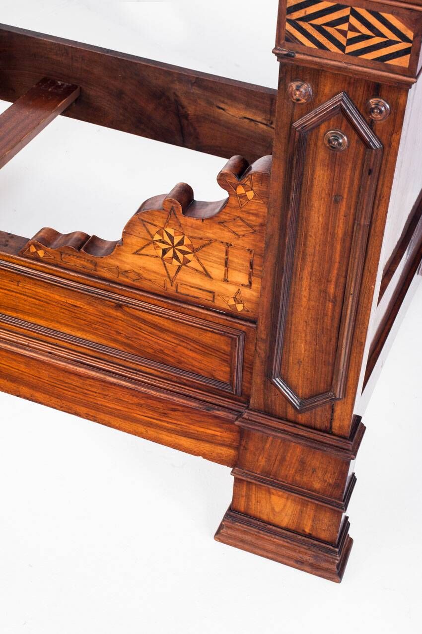 Bed made of solid walnut with marquetry details. France, 1930s.