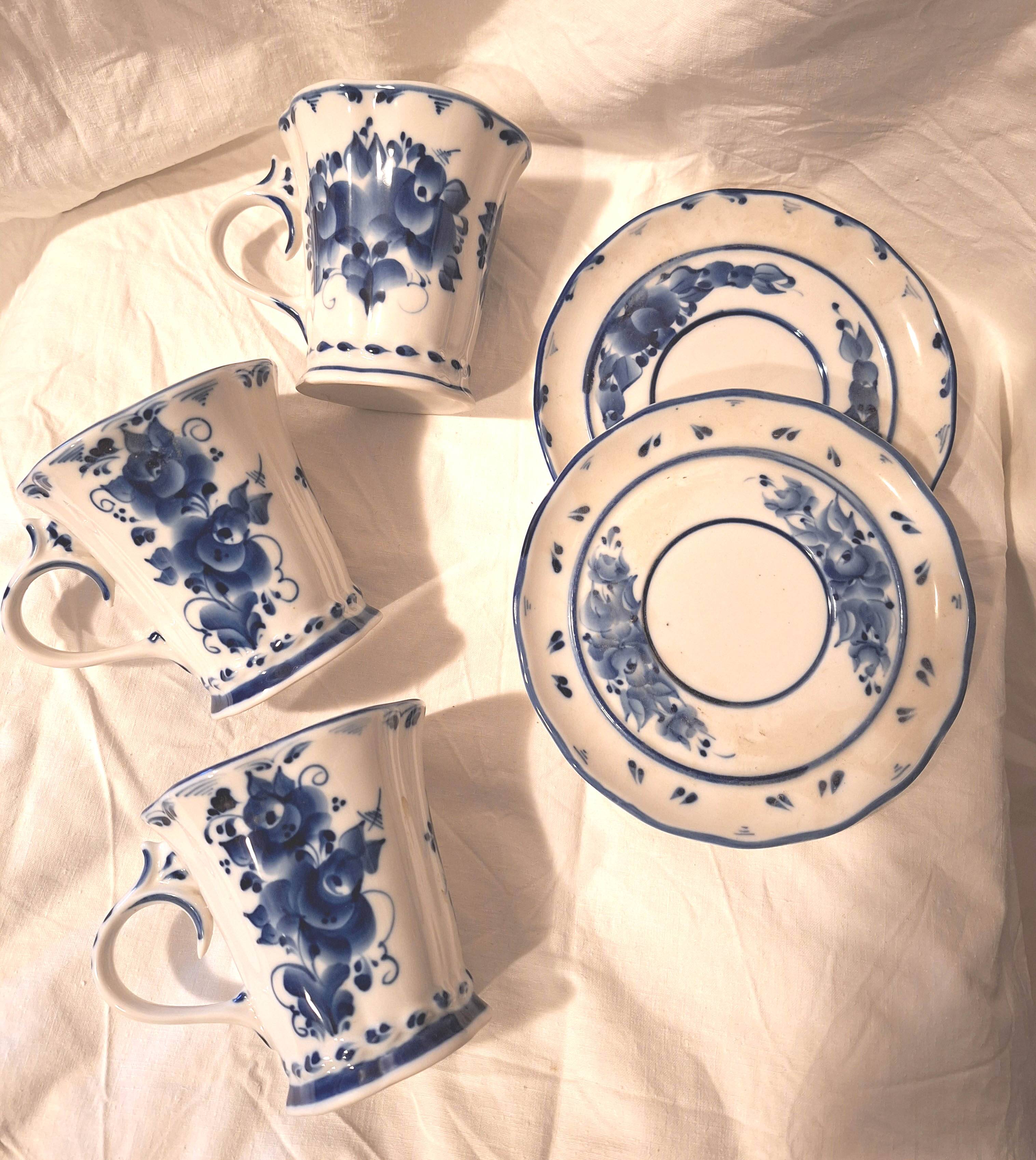 Three cups and two saucers made of Gzhel porcelain.
