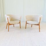 Mid-century lounge chairs in sheepskin/shearling and stained wood, Sweden, 1962.