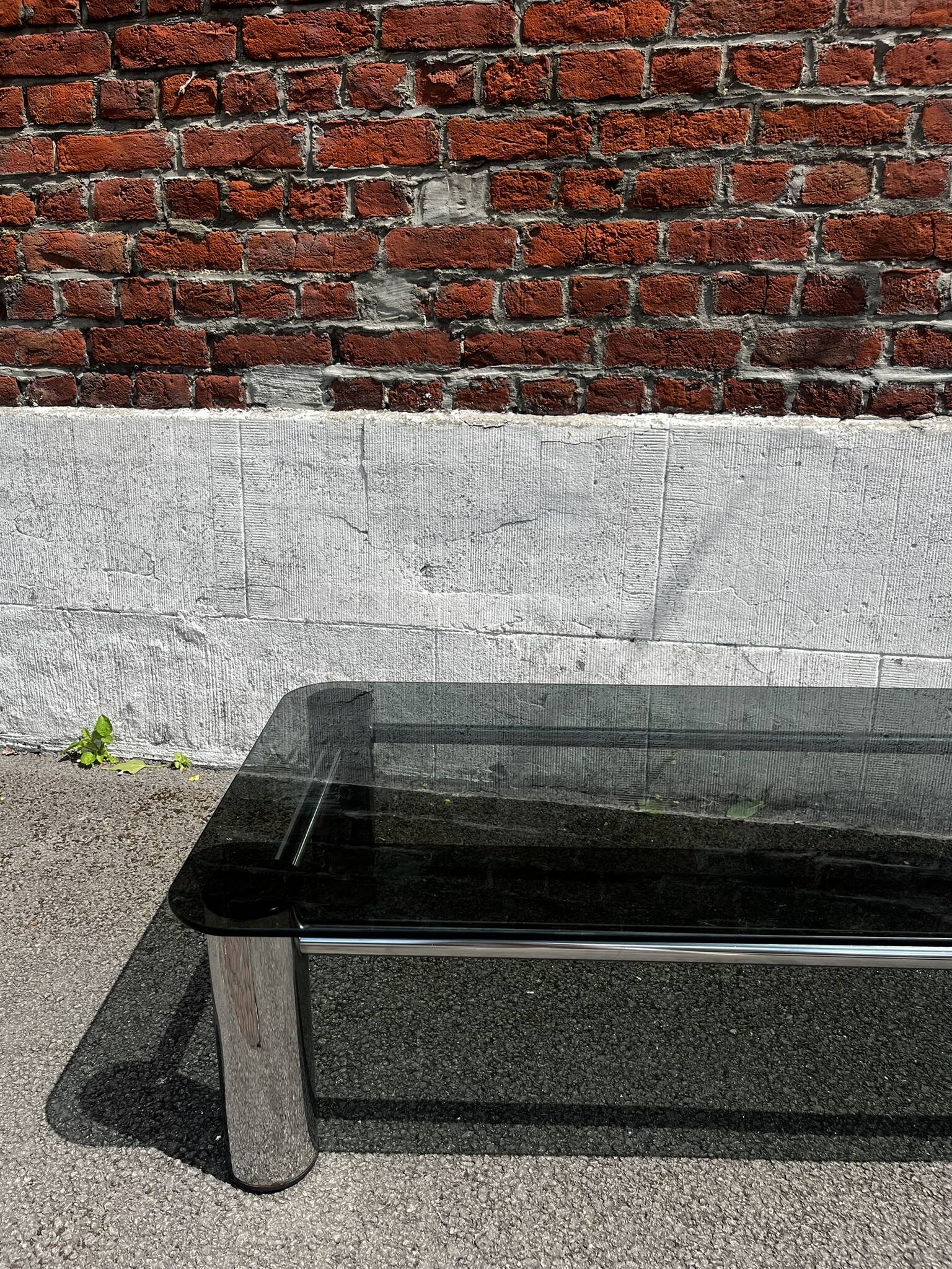 Vintage coffee table with smoked glass and chrome.