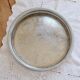 Large round vintage silver-plated metal tray, engraved and pierced.